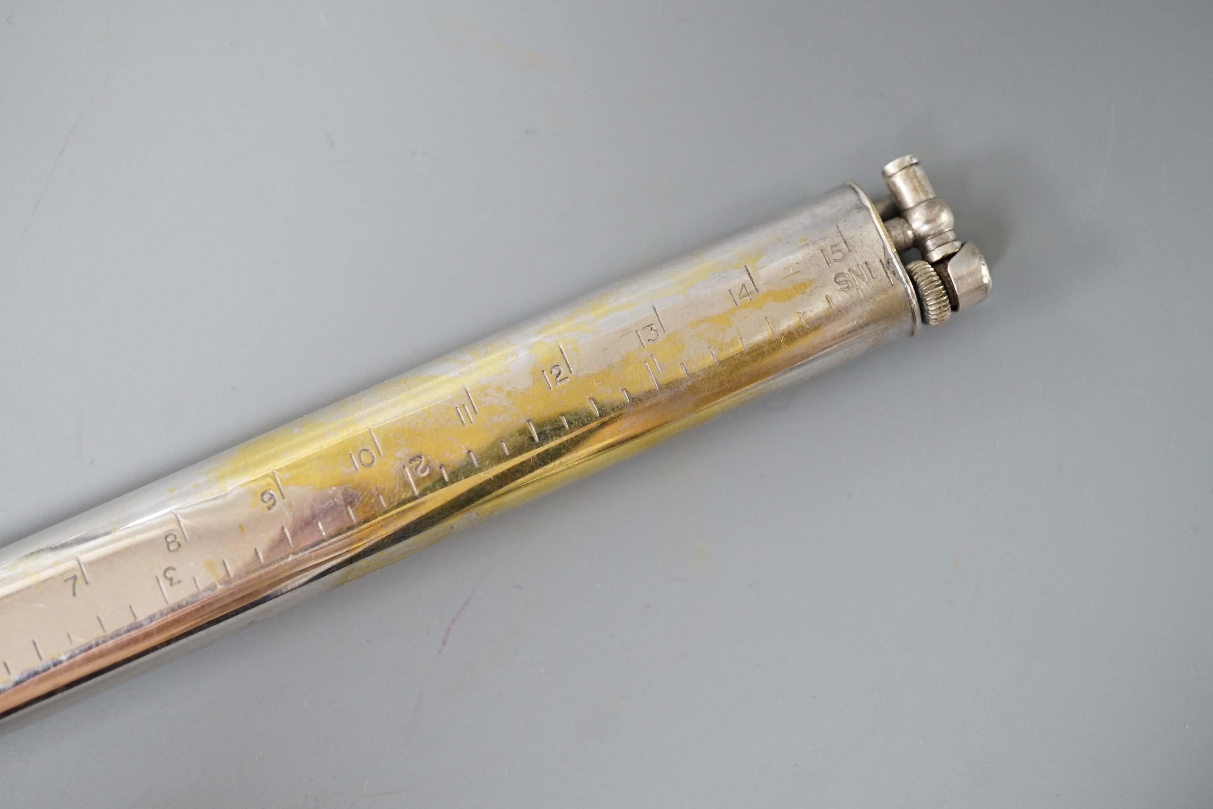 A silver plated novelty Dunhill ‘ruler’ lighter, inscribed by the actress Ann Todd, 16.5 cms long.